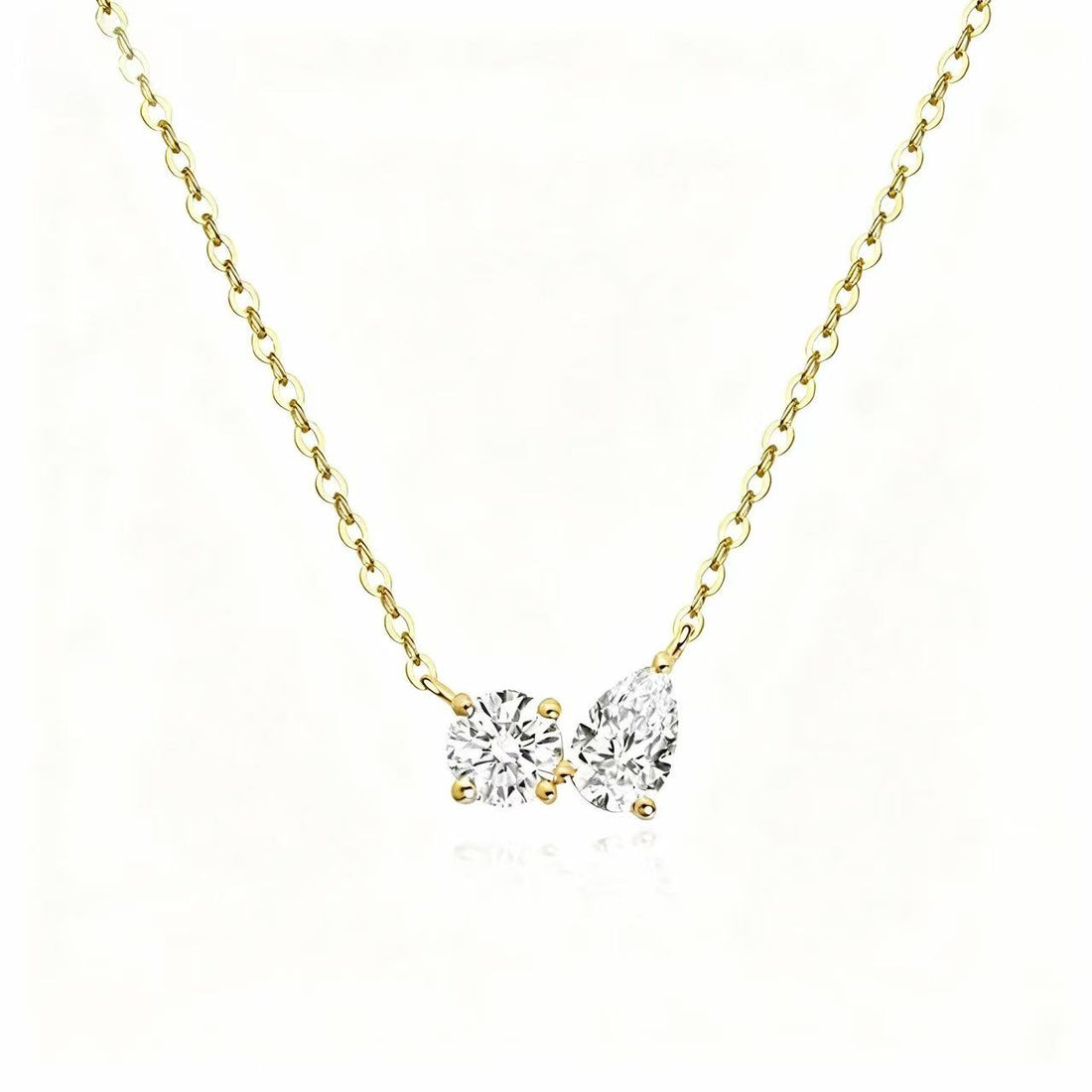 The Story Behind the Elegant Duet Round & Pear Necklace