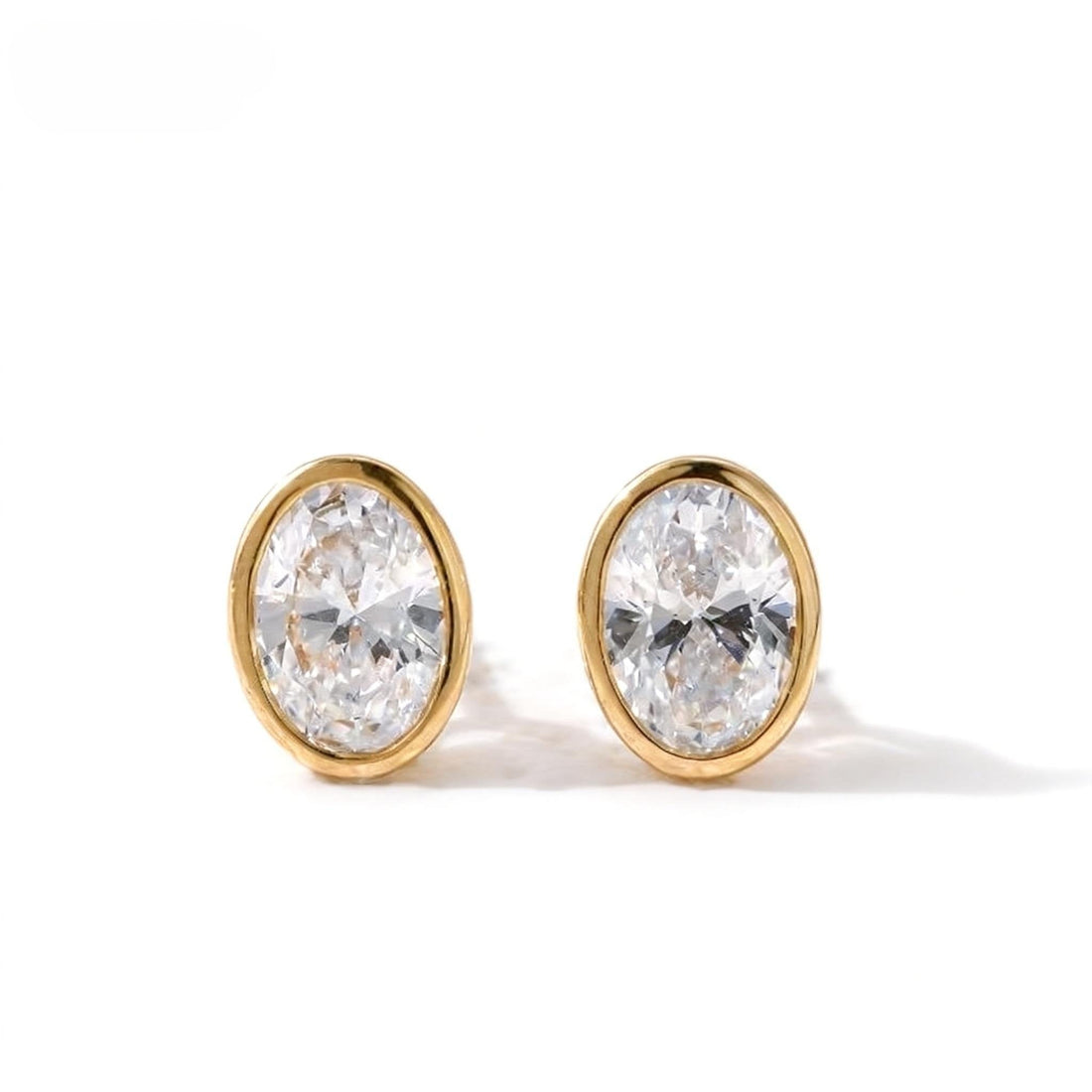 The Story Behind the Bezel Oval Stud Earrings