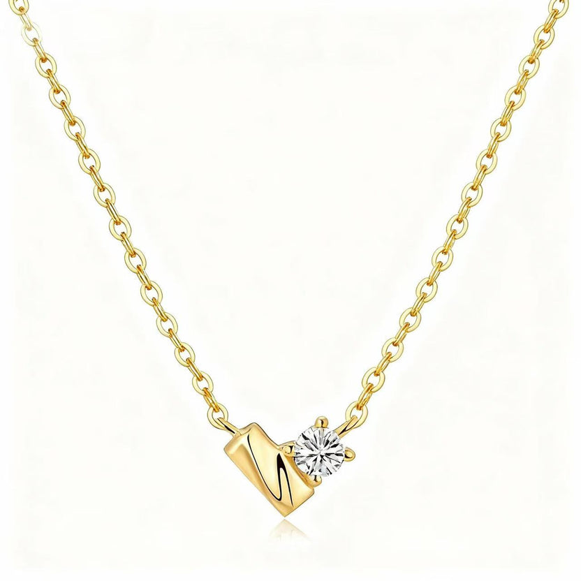 Close view of original Heart of Light yellow-gold necklace and its single round lab-grown diamond