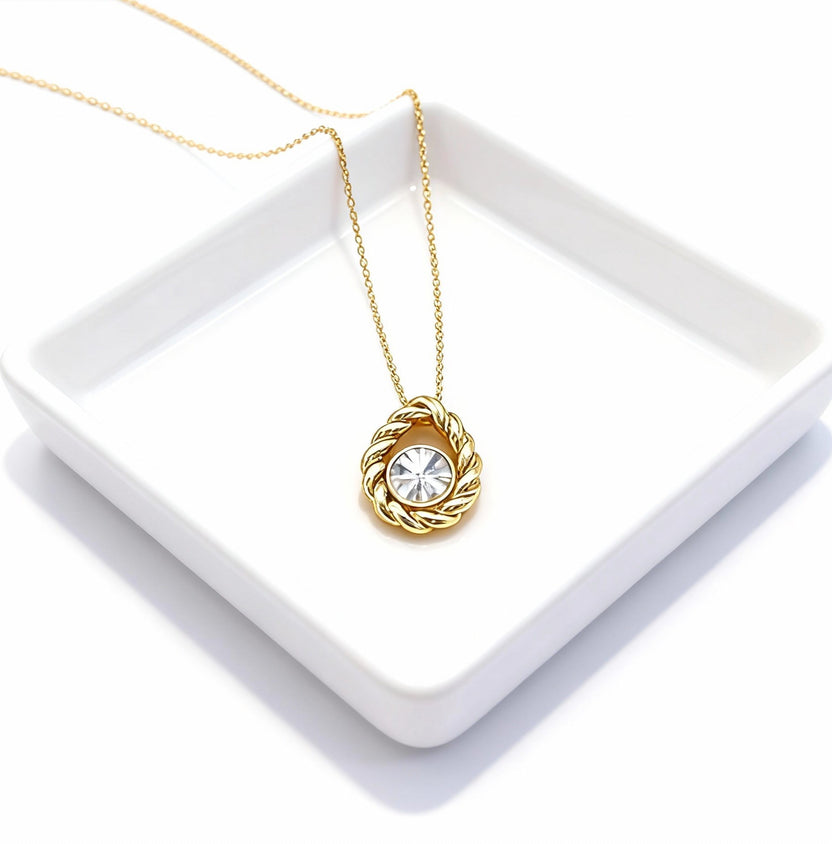 Single Solitaire Twist yellow-gold necklace with a round lab-grown diamond on a white tray