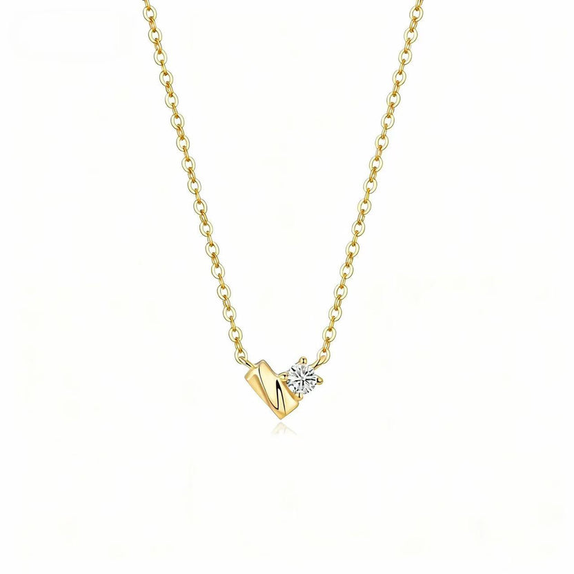 Original Aetheris Heart of Light necklace: one round diamond beside a sculpted 18K gold motif on a 45 cm chain