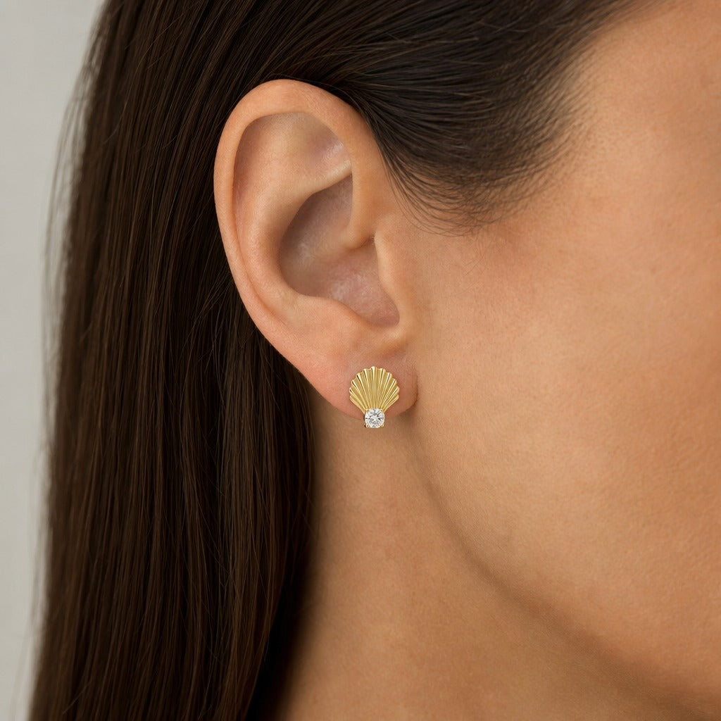 Aetheris Ribbed Scallop Shell Studs, cushion lab-grown diamond stud earrings, worn on the ear, side view