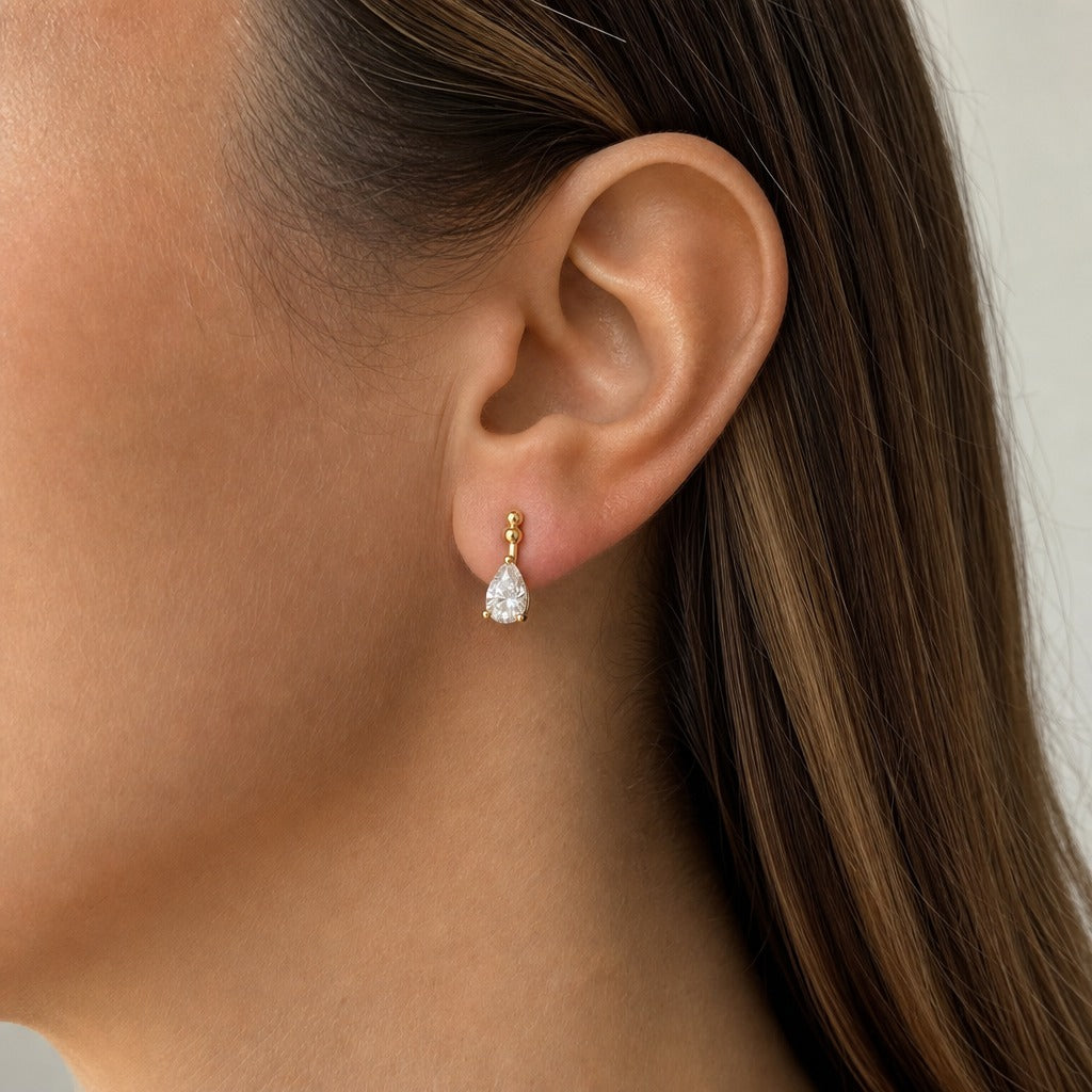 Aetheris Slanting Rain Pear Studs, pear lab-grown diamond stud earrings, worn on the ear, side view
