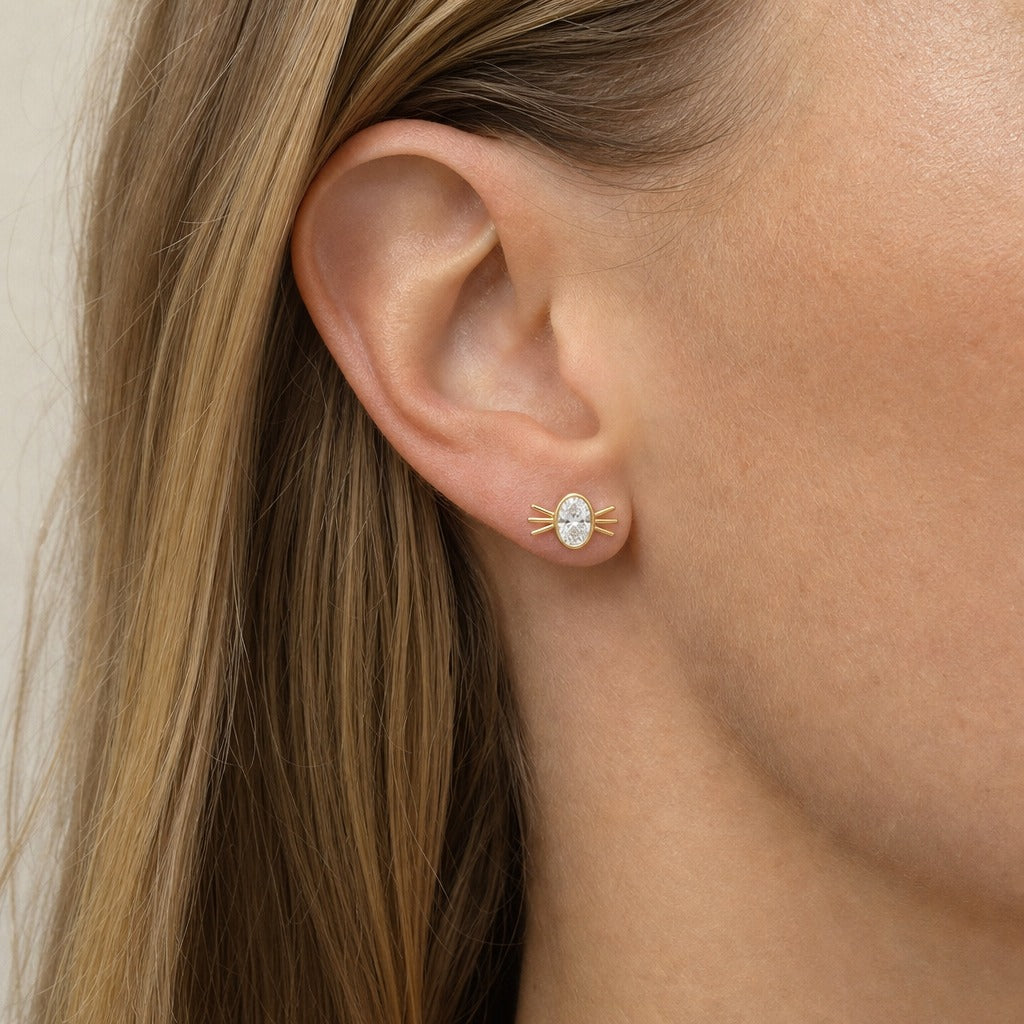 Aetheris Six Whiskers Oval Studs, oval lab-grown diamond stud earrings, worn on the ear, side view